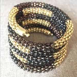 Gold and bronze toned beaded coil bracelet